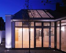 View from terrace into illuminated house