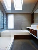 Designer bathroom with skylights and made-to-measure installations in attic storey