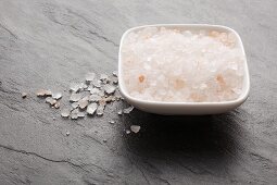 Himalayan salt in a bowl and on a slate platter