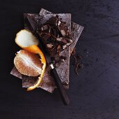 Pieces of chocolate and oranges