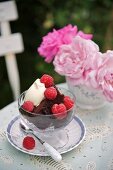 Chocolate fudge cake with raspberries and cream