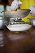 Coconut milk being made