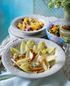 Chicory salad, with tabbouleh with oranges and bean salad in the background