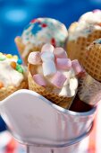 Ice cream cones filled with sweets (marshmallows and chocolate beans)