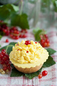 A cream tart with redcurrants