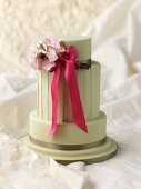 Wedding cake with a bow and flowers