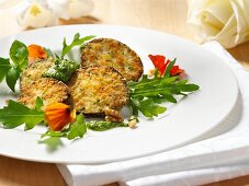 Roasted eggplant with pesto and edible flowers