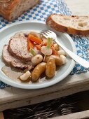 Roast pork with beets, carrots and potatoes (France)