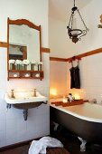 Vintage bath with free standing bath tub and candle light