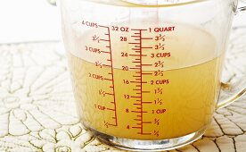2 1/2 Cups of Chicken Broth in a Measuring Cup