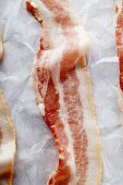 Bacon Strips on Parchment Paper; From Above