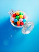 Colourful gobstoppers in a glass jar