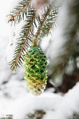 Gold and green pine cone decoration