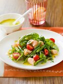 Warm salmon salad with caper dressing