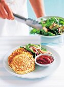 Corn fritters with rocket salad