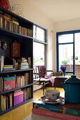 Blue bookcase in room with yellow polished concrete floor