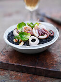 Black rice with grilled octopus and sprout leaves