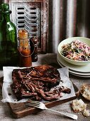Grilled, smoked beef brisket with coleslaw and barbeque sauce (USA)