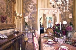 Festive set table in grandiose setting of Baroque dining room