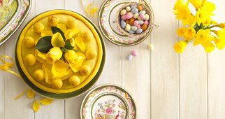 Simnel cake and sugared eggs on an Easter table (seen from above)