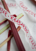 Ribbon with writing above rhubarb stems