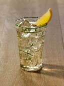 Mojito in a Green Rimmed Glass with a Lemon Wedge Garnish