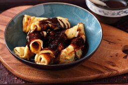 Crepe rolls with chocolate sauce