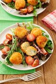 Potato croquettes with Roquefort on a mixed leaf salad