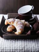 Chocolate croissants and coffee cups