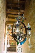 Vintage chandelier decorated with glass droplets and clock ornaments