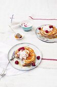Pancakes with raspberries, ricotta and maple syrup