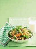 Hokkien noodles with pork, mange tout, carrots and sesame