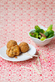 Fried vegetable balls with a side salad