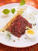 Oriental beef tatar with boiled egg