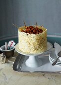 Vanilla mousse layer cake with caramelised hazelnuts