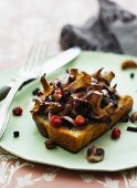 Toast topped with mushrooms and cranberries