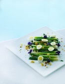 Spring onions with egg and edible flowers