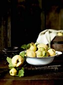 Fresh quinces with leaves