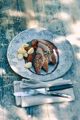 Duck breast with red wine and cinnamon sauce and gnocchi