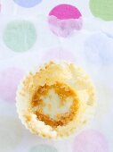 Cupcake cup with crumbs around the sides