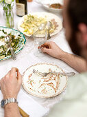 Emptied plates in front of a man