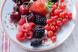 Fresh berries and cherries on a plate