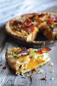 Pumpkin pie with bacon and red onions
