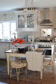 Rustic kitchen with old wooden table and metal chairs