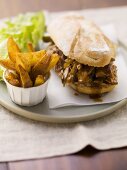 Pulled pork sandwich and potato wedges