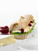 Baguette sandwich with brie and marmalade