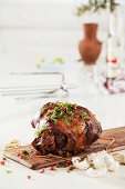 Leg of lamb with garlic, herbs and pomegranate seeds
