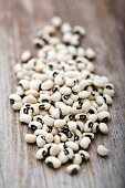 Black-eyed peas on a wooden surface
