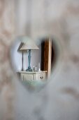 View of bedside cabinet through heart-shaped cut-out