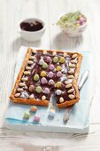 Mazurek (Polish Easter cake) with chocolate, almonds and sugar eggs